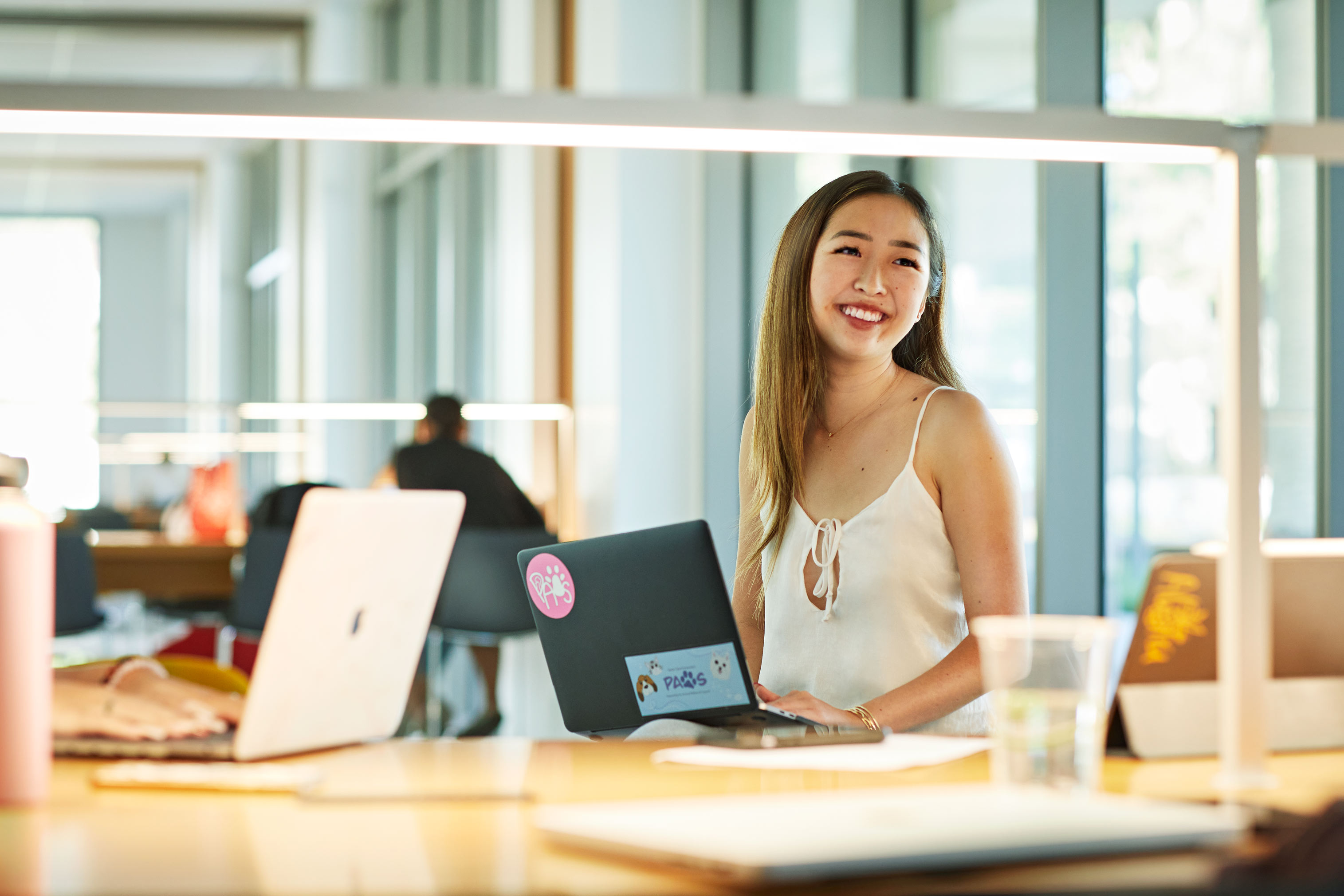young alumni on computer laptop